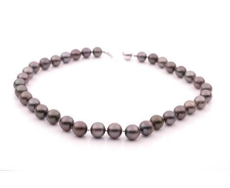 A Tahitian grey pearl necklace, the pearls approximately 12 mm diameter, fastened with a 9ct white gold ball clip clasp, 47 c