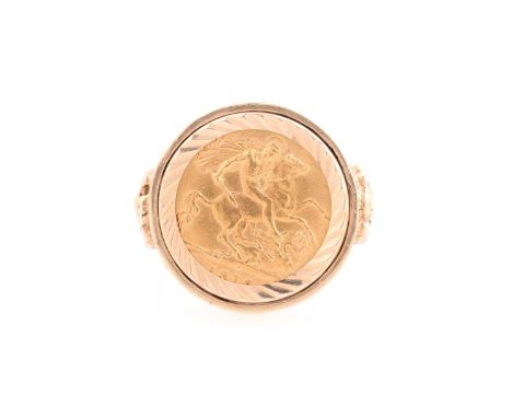 A George V half sovereign ring, set in 9 ct gold mount cast with helraldic shields to the shoulders on a textured ground, rin