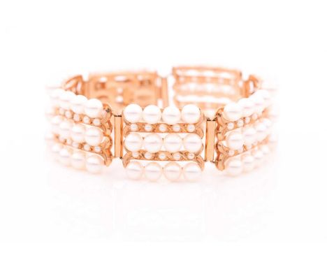 A yellow metal and pearl bracelet, comprised of seven openwork rectangular segments set with rows of cultured pearls, approxi