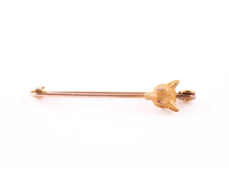 A yellow metal fox head bar brooch, set with ruby eyes, head 10 mm long, pin unmarked, brooch 5.1 cm long.Condition report: 3