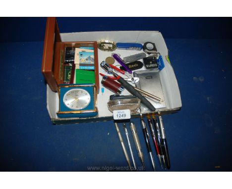A quantity of miscellanea including coral travel clock, cigarette case, Ronson lighter, penknife, tape measure, small box con