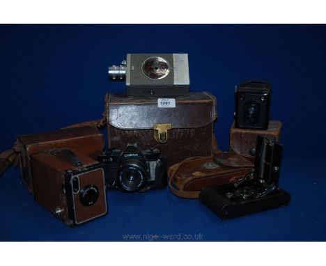 A Cosina CT - 1 Camera with Cosina 50 mm lens, a cased Bell & Howell 16 mm cine Camera, Erabox Zeiss Ikon Box camera, cased p