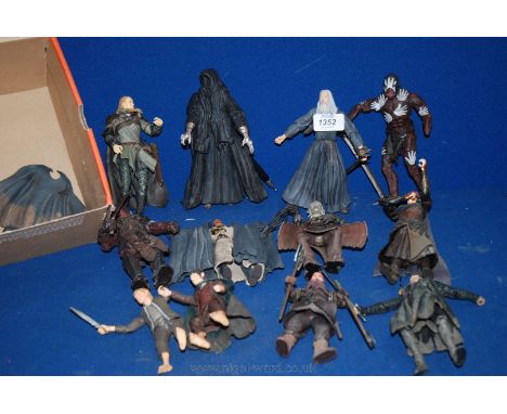 A quantity of Lord of The Rings action figures.