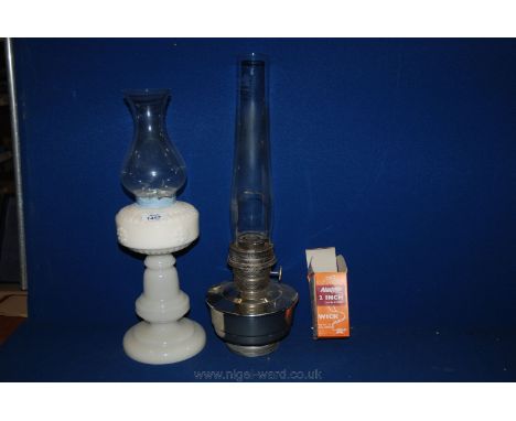A white glass Oil Lamp Base and a chrome oil lamp.