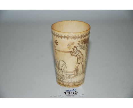 A very fine small horn beaker engraved with a hunting scene well pointed against the cream body, 3 3/4'' tall.