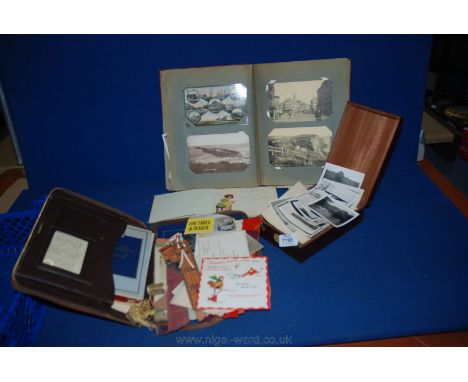An Album of old Postcards, greetings cards, newspaper clippings etc., together with a leather writing case with bookmarks, gr