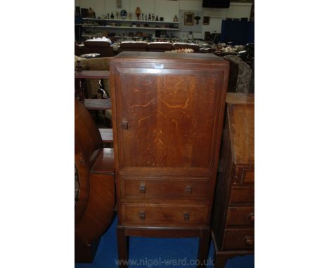 A ''Brynmawr Furniture Makers'' Oak bedside Cabinet, moulded edge top over single raised and fielded panel door, over flight 