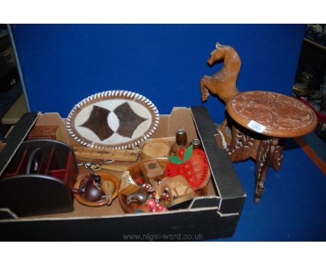 A box of miscellaneous wooden items including rearing Horse, the Big Apple naughts and crosses, small wooden collapsible tabl