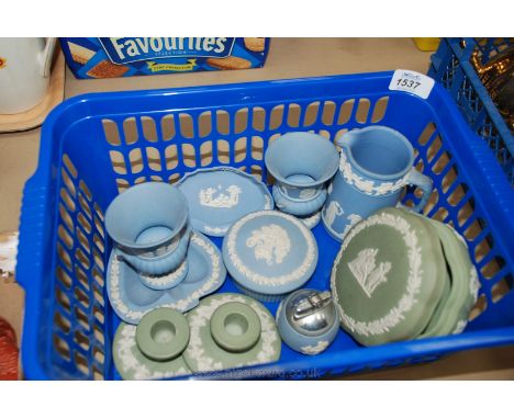A quantity of blue and green Wedgwood Jasperware including candlesticks, trinket pots, vases, lighter, etc.