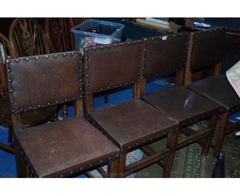 A set of four Oak framed Dining Chairs, brown patent leather button back supports and seats, standing on square legs and stre