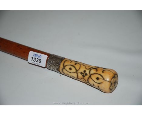 A fine late 17th century English ivory and silver pique walking stick handle, typically decorated with roundels and geometric