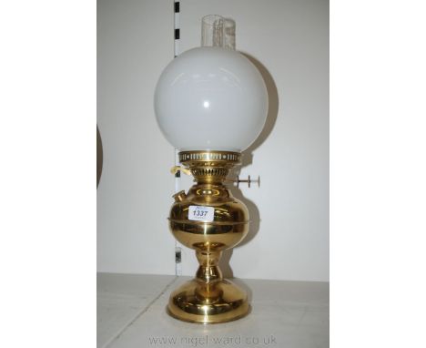 A Brass Oil Lamp with twin burner complete with shade and chimney.