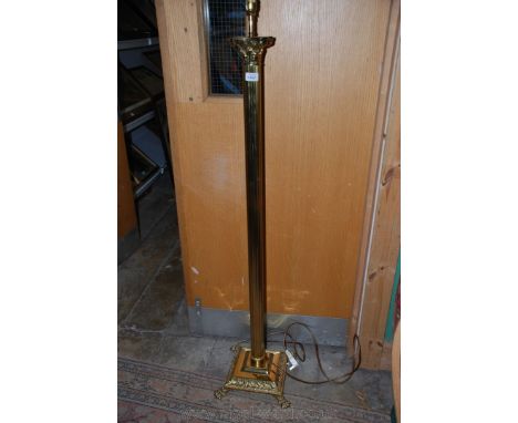 A Brass column Standard Lamp on square base with paw feet.