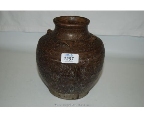 An early brown glazed Thai storage jar with 4 loop attachments, 15th-17th century. In very good condition, 8'' tall.