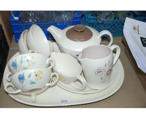 A quantity of Poole 'Trudiana' Dinner ware including teapot, milk jug, soup coups, serving platters, sauce boat, etc.