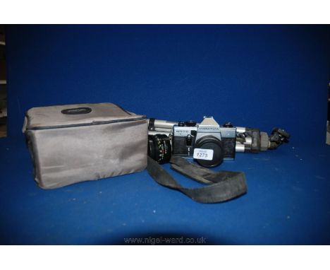 A Praktica MTL 5B Camera and case with tripod.