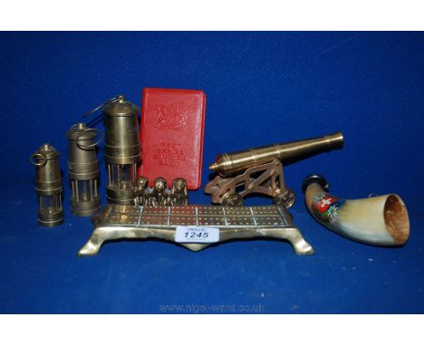 A quantity of miscellanea including small brass cannon, three miniature Davy Lamps, brass cribbage board, alphorn and a Post 