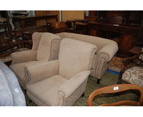 A late 19th/early 20th c. three piece Lounge Suite, comprising armchair, wing back armchair and two seater drop end sofa, uph