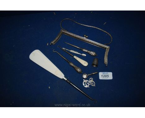 An Edwardian Handbag clasp, various Silver handled button hooks and tools, Silver napkin holder, etc.