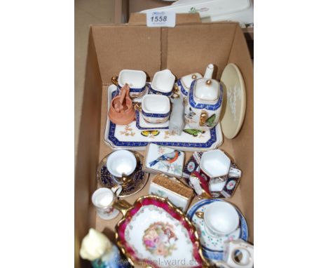 A quantity of china including miniature cups and saucers, miniature Teaset on a tray, two Limoges trinket dishes, matchbox ho