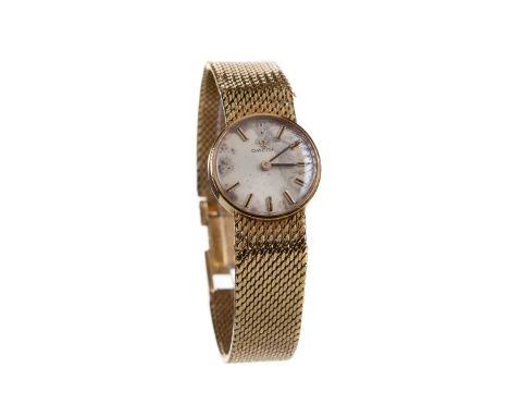 LADY'S OMEGA EIGHTEEN CARAT GOLD MANUAL WIND WRIST WATCH,the round silver coloured dial with applied baton hour markers, 19mm