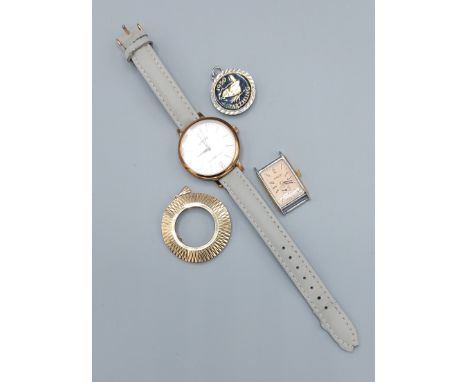 A 9ct gold pendant mount, 3.4gms together with a Tissot ladies tank watch, another wristwatch by Lorus and a pendant 