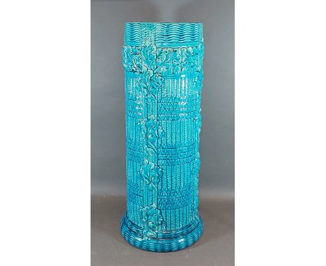 A Burmantofts blue glazed stick stand of stylised form, 57cms tall 