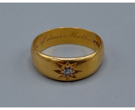 A 22ct gold band ring set solitaire diamond, 6.8gms, ring size Q 