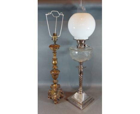 A silver plated oil lamp with cut glass well, glass chimney and opaque glass shade together with an 18th Century style table 