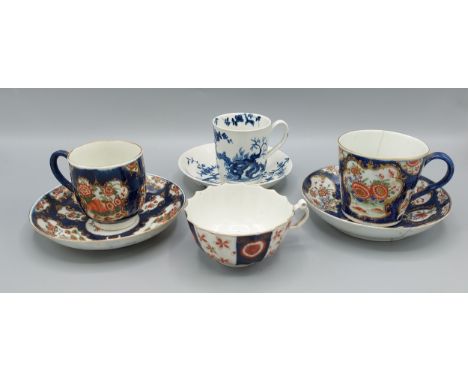 A First period Worcester cup and saucer together with two similar first period Worcester cups and saucers and a similar cup 