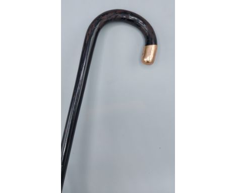 A 9ct gold mounted walking stick 