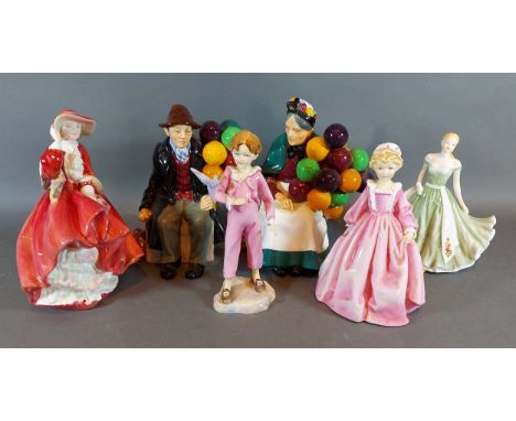 A Royal Doulton figurine The Balloon Seller HN 1315, together with The Balloon Man HN 1954, Top O'the Hill HN 1834, two Royal