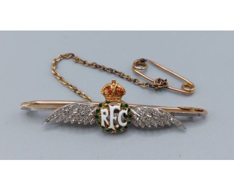 A 15ct gold RFC bar brooch in the form of wings set with diamonds and enamel, 5.3gms 