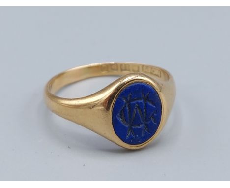 An 18ct gold signet ring set blue stone, 3.8gms, ring size Q 