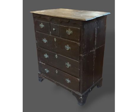 A George III oak chest, the moulded top above three short and three long drawers raised upon bracket feet, 84cms wide, 48.5cm
