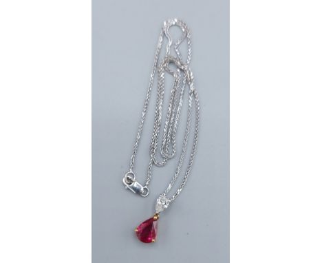 An 18ct gold pendant set with a pear shaped Ruby, approx. 1.47ct and a pear shaped Diamond, approx. 0.30ct together with fine