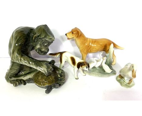 A group of ceramic animal figures, including a large monkey catching a terrapin; a retriever; duck and similar (5)