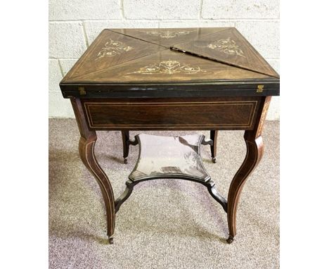 A late Victorian rosewood and marquetry envelope card table, circa 1890, the four fold top opening to reveal a green baize ga