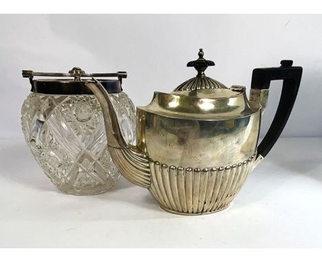 A Victorian silver teapot, hallmarked London 1894, Henry Wilkinson &amp; Co., of typical oval part fluted form, with ebonized