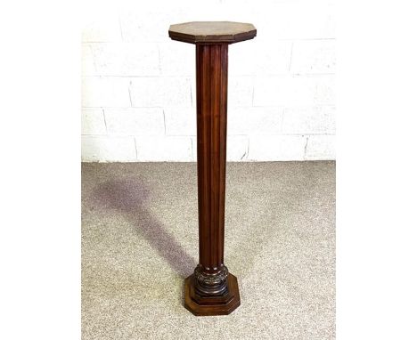 A handy heavy mahogany George III style torchere or portrait bust stand, 19th century, with fluted pillar and stepped octagon