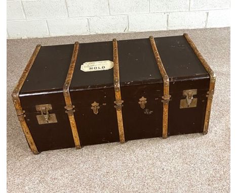 A vintage leather and wood bound travelling trunk, early 20th century, 110cm long; together with five vintage leather, hide a