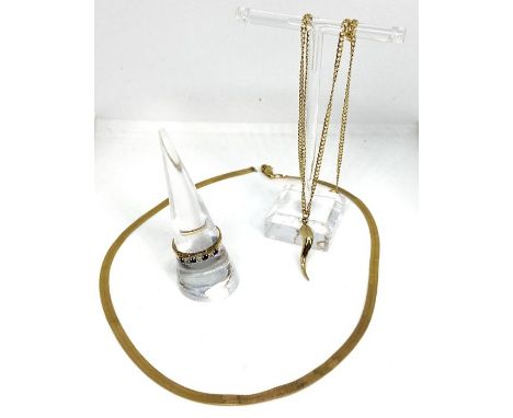 A 9 carat gold woven lace necklace, marked Italy 9kt; also a 9 carat gold pendant and chain; and a 9 carat gold sapphire and 