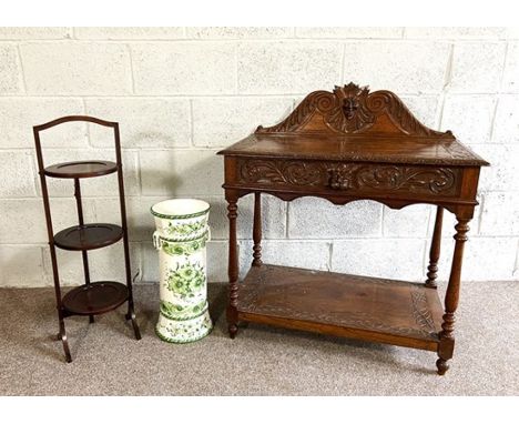 A late Victorian Jacobean style oak hall table, with gallery back and single drawer, carved with a &ldquo;green Man&rdquo; ma