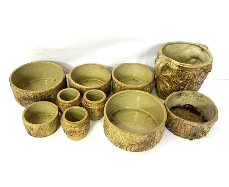 A group of rustic styled ceramic planters (10)