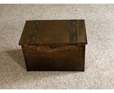 A vintage hammered and nailed copper coal box or ottoman, 33cm high, 55cm wide, and a small jointed bench (2)