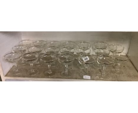 SHELF OF 20 VINTAGE CHAMPAGNE GLASSES