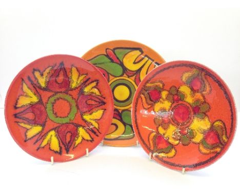 Three various Poole Pottery Delphis plates.