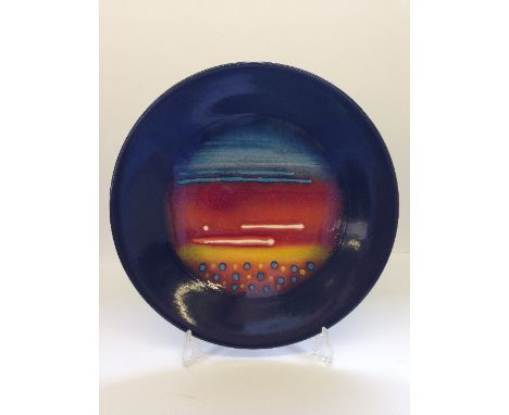 A Poole Pottery Planets charger: Jupiter from a Limited Edition by Alan Clarke to mark the alignment of the planets 5.5.2000.