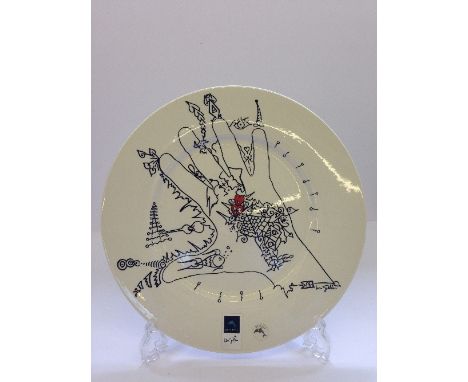 A set of four Poole Pottery plates designed by Uri Geller.