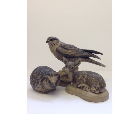 A Poole Pottery Barbara Linley Adams stoneware model of a Merlin together with a Hedgehog and small Fawn.